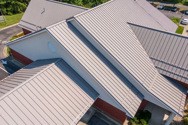 Aerial view of light gray standing seam metal roofs