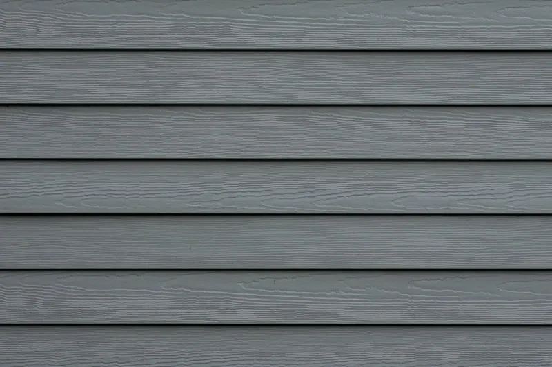 Close view of gray lap siding