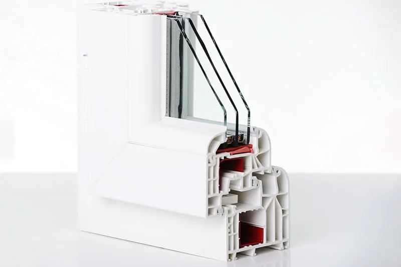 Cutaway of a vinyl window frame showing three panes of glass
