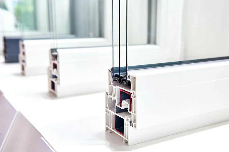 Cutaways of vinyl window frames with three panes of glass